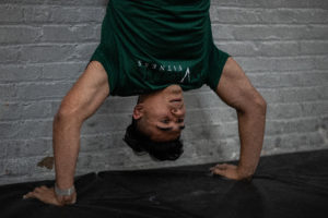 Athlete doing a handstand push-up.