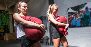 Jenn Ryan holds a sandbag during sandbag training